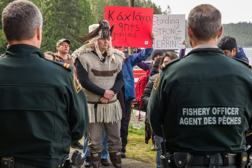 Frank Brown faces off against DFO officers in a Heiltsuk protest