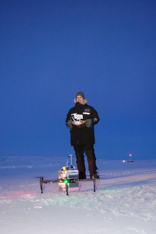A researcher getting ready to send a drone up in the Arctic. Photo by Dalhousie University