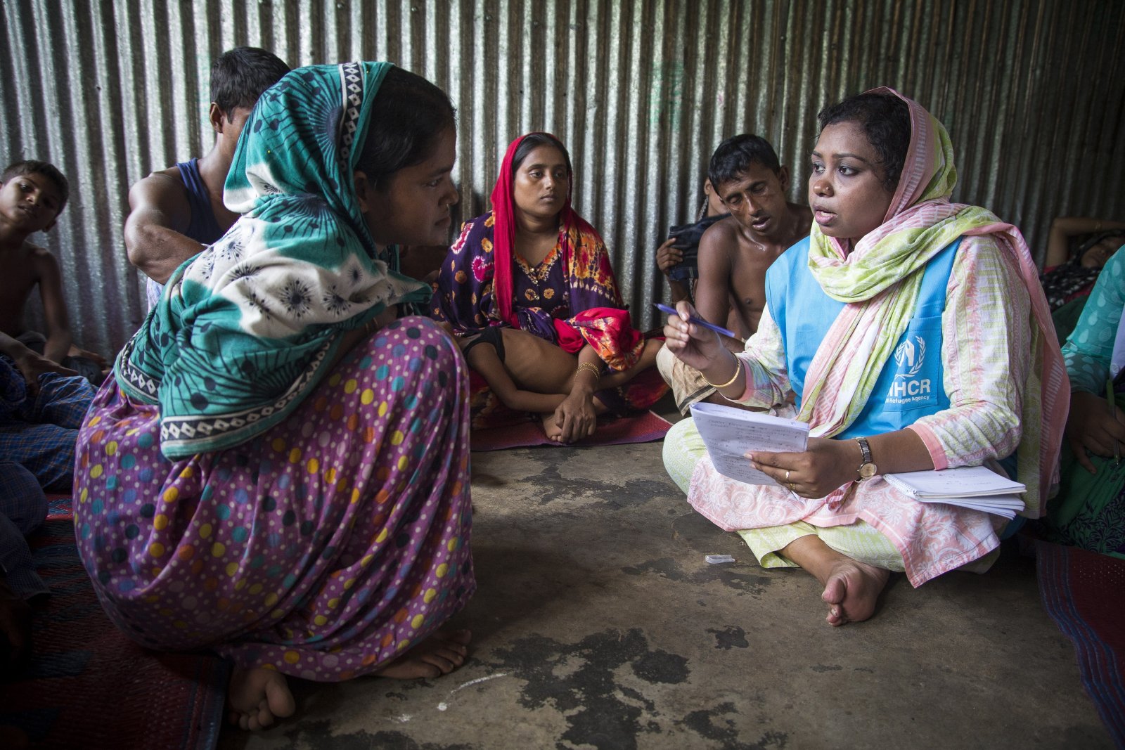 Rashida Begum, 23, a Rohingya shipwreck survivor who lost relatives when her boat capsized on Inani Beach near Cox’s Bazar, receives counselling from UNHCR psychologist Mahmuda at Kutupalong refugee camp in Bangladesh. Photographer Roger Arnold