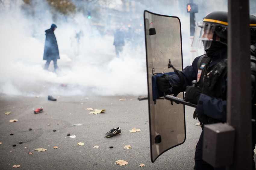 Paris police tear gas climate protesters before COP21 -- photo by World Council of Churches Sean Hawkey