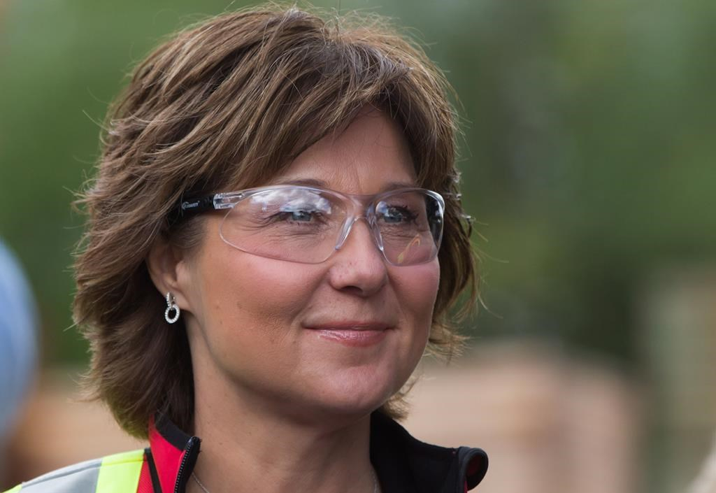Liberal Leader Christy Clark wears safety glasses during a campaign stop at CedarLine Industries, a manufacturer of western red cedar products, in Surrey, B.C., on Monday April 24, 2017.