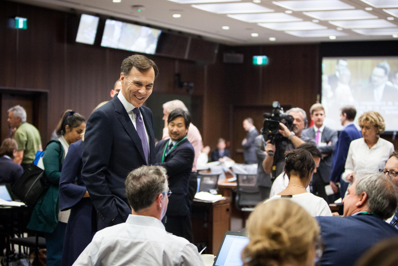 Finance Minister Bill Morneau talks with reporters in Ottawa