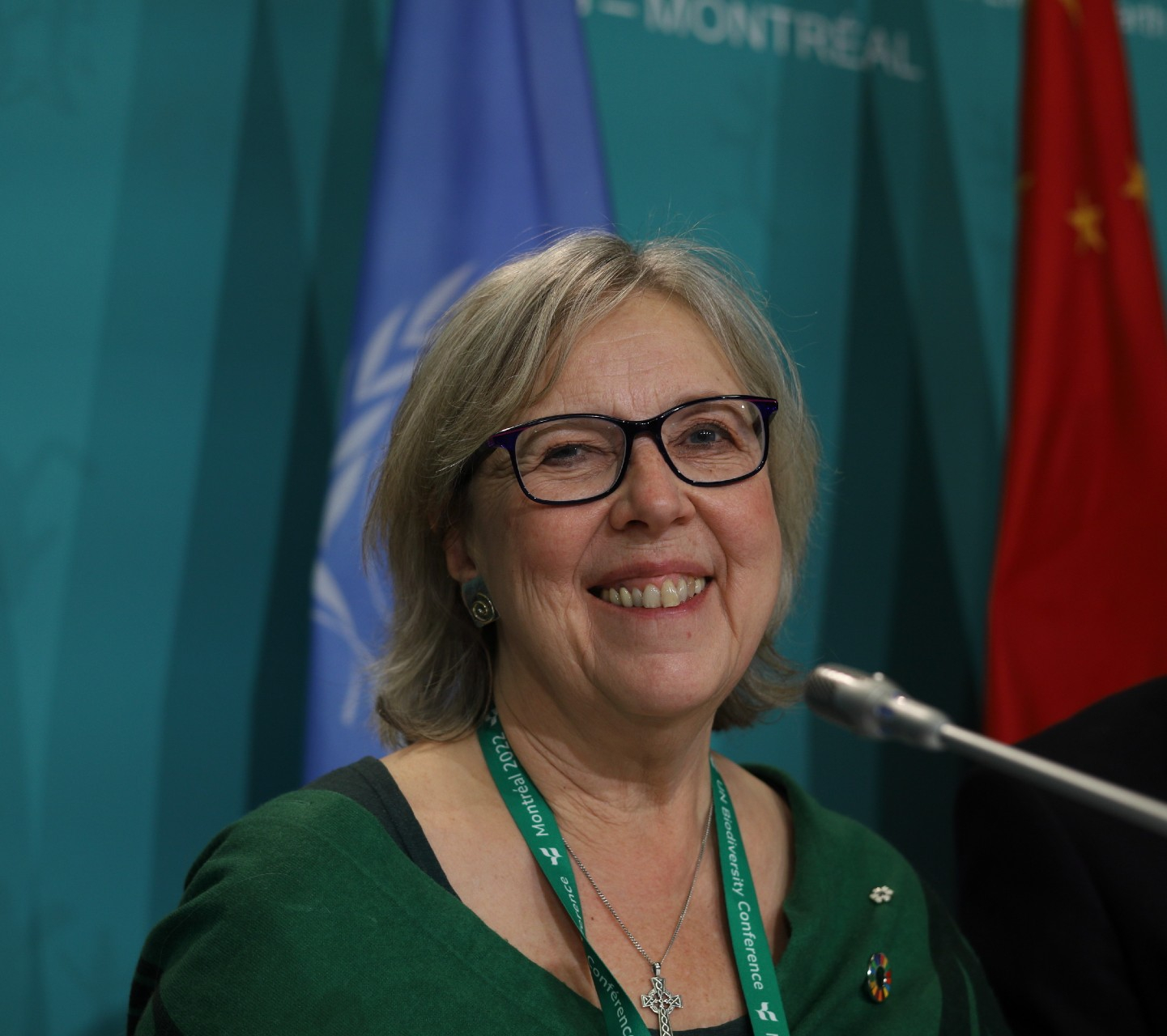 Elizabeth may sits at the conference stage at cop15 in montreal
