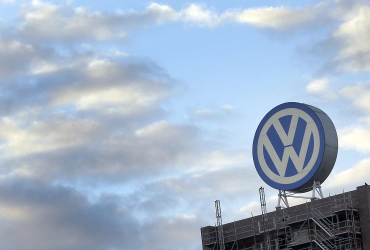 Volkswagens's iconic symbol looms above one of its buildings. Photo by Michael Sohn/Associated Press