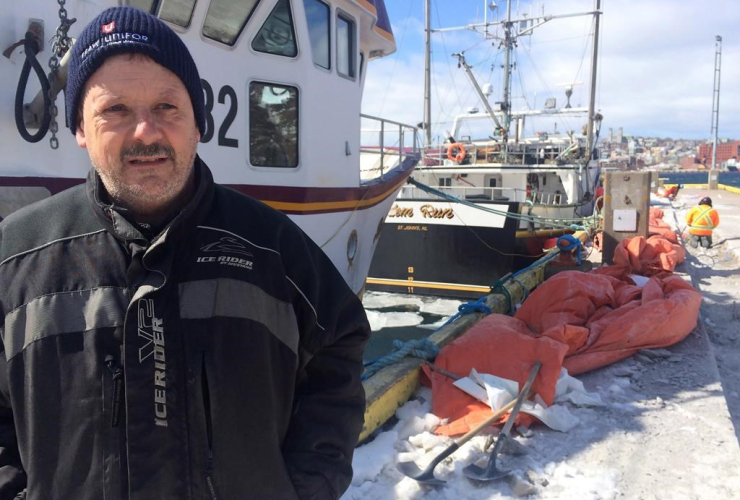 Fisherman Glen Winslow is shown in front of his vessel the Roberts Sisters ll in St.John's, N.L. He says a federal update on rebounding northern cod stocks is good news but any lifting of the 1992 commercial fishing moratorium is still some time off