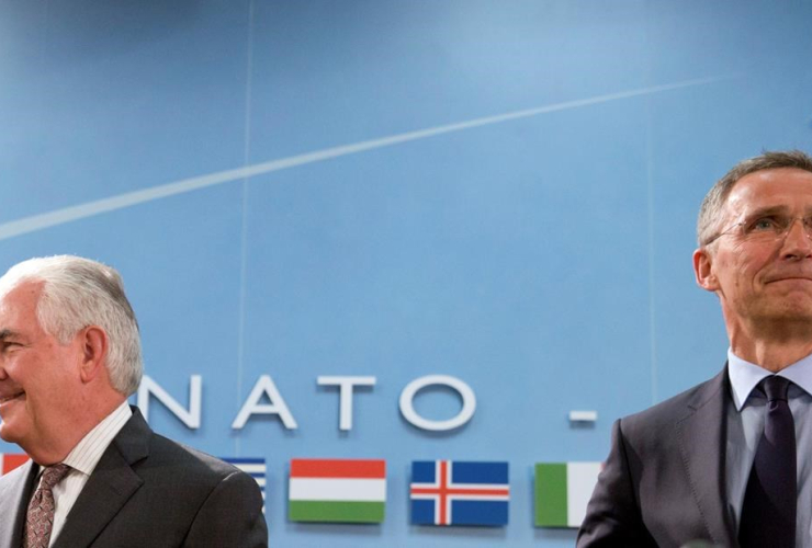 U.S. Secretary of State Rex Tillerson, left, and NATO Secretary General Jens Stoltenberg wait for the start of a meeting of the North Atlantic Council at NATO headquarters in Brussels on Friday, March 31, 2017.