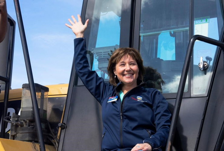 B.C. Liberal Leader Christy Clark waves to supporters from a front-end loader during a campaign stop at Kentron Construction, in Kitimat, B.C. on Thursday, April 13, 2017.
