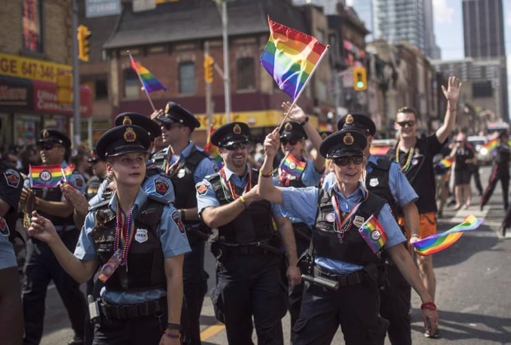Hamilton, Ont. police officers march along the parade route during the annual Pride Parade in Toronto, Sunday, July 3, 2016.