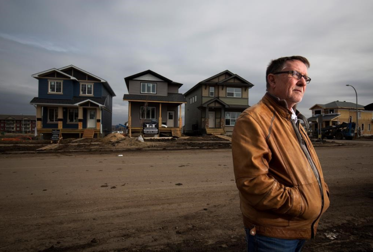 Gilles Huizinga president of the local Urban Development Institute and a homebuilder with Sedgewood Homes with newly built homes in the Timberlea area that was destroyed by wildfires last year in Fort McMurray, Alta. on April 20, 2017.