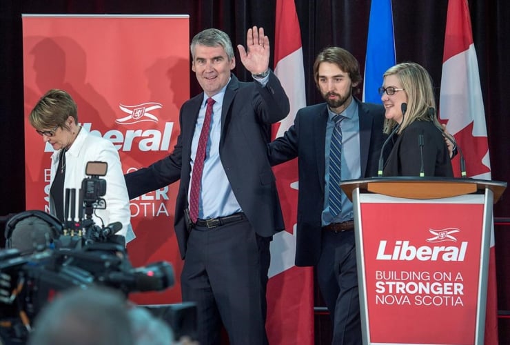 Nova Scotia Premier Stephen McNeil waves as he heads from the stage with his wife Andrea, daughter Colleen and son Jeffrey after addressing supporters at his election night celebration in Bridgetown, N.S.