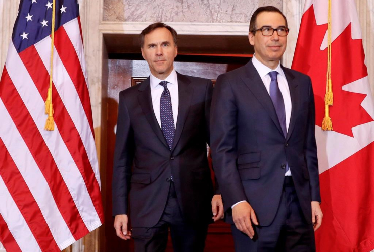 Treasury Secretary Steven Mnuchin walks with Canadian Finance Minister William F. Morneau before their bilateral meeting at the Treasury Department in Washington on March 1, 2017.