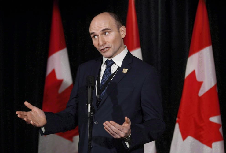 Social Development Minister Jean-Yves Duclos speaks to reporters at a Liberal cabinet retreat in Calgary, Alta., Tuesday, Jan. 24, 2017.
