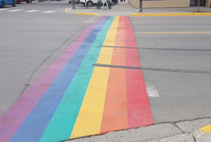 Tire burnout marks are seen on a crosswalk painted with the colours of the rainbow in honour of the LGBTQ community, on Tuesday, June 13, 2017, in Whitehorse, Yukon Territory. Handout photo by CKRW/Tim Kucharuk