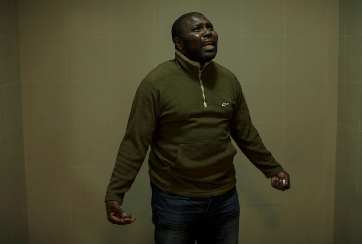 Franklin Njomo, an asylum seeker from Cameroon, is pictured in his Toronto apartment block on Thursday, June 8, 2017, as he speaks about being away from his two children. 
