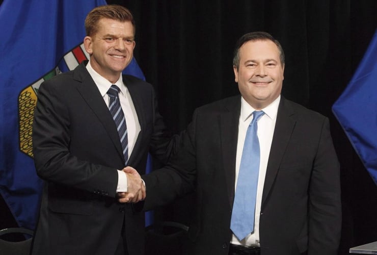 Alberta Wildrose leader Brian Jean and Alberta PC leader Jason Kenney shake hands after announcing a unity deal between the two in Edmonton on May 18, 2017. 