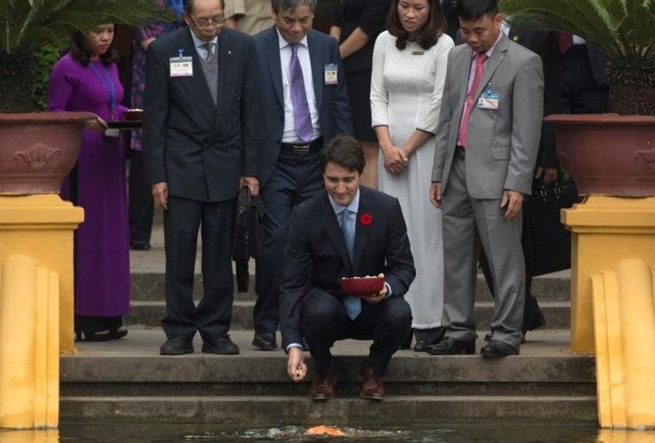 Canadian Prime Minister, Justin Trudeau, feed, fish, Ho Chi Minh stilt house, Hanoi, Vietnam,
