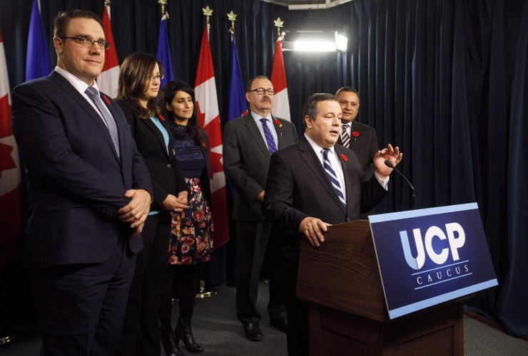 UCP Leader Jason Kenney, centre, stands with his leadership team, from left, Jason Nixon, Angela Pitt, Leela Aheer, Ric McIver and Prab Gill, in Edmonton Alta, on Monday, October 30, 2017. 