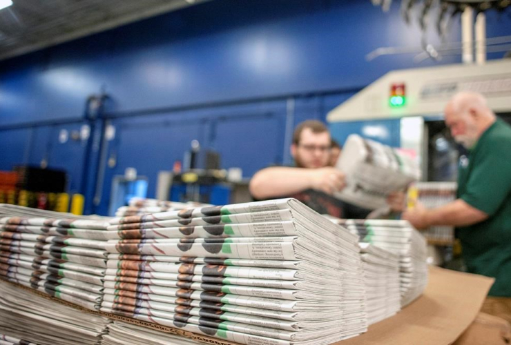 production workers, stack newspapers, Janesville Gazette Printing & Distribution plant, Janesville, 