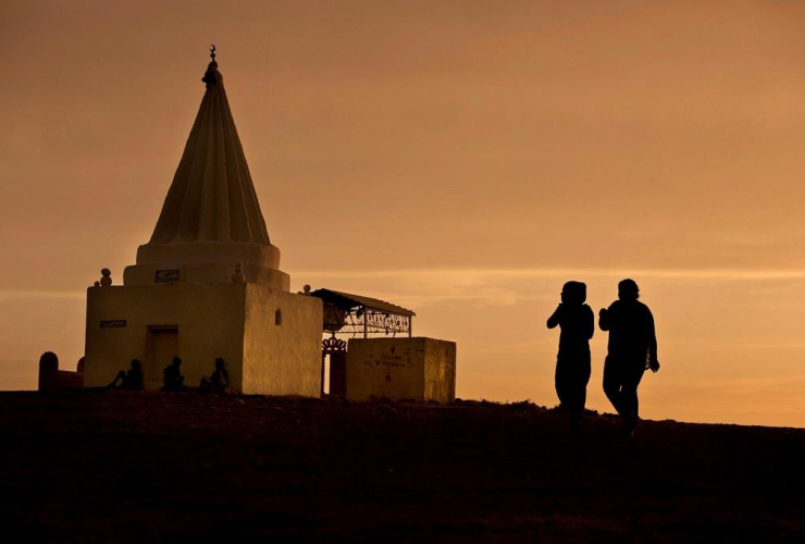 sun sets, women, Yazidi shrine, Kankhe Camp, Dahuk, Iraq,