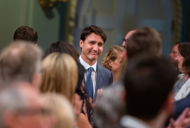 Prime Minister Justin Trudeau arrives in the hall as the Liberal government proceeded to a swearing in ceremony for the new ministers after a summer shuffle at Rideau Hall in Ottawa, on July 18th 2018. Photo by Alex Tétreault