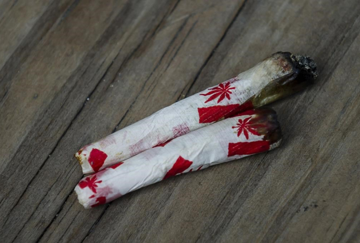 Cannabis joints, Canadian-themed paper, legalized marijuana event,