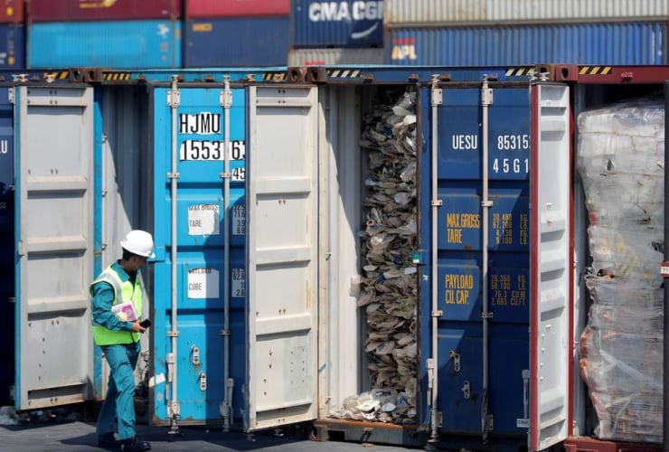 Malaysian official, inspects, container, plastic waste shipment, 