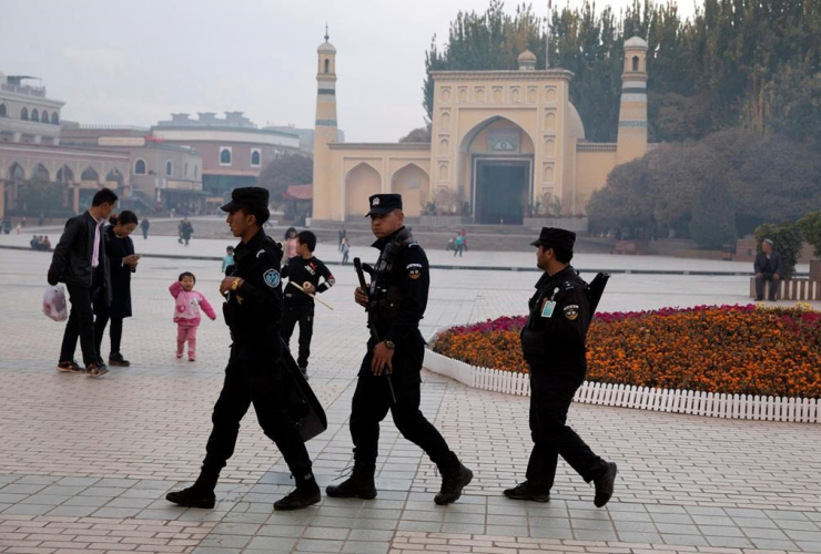 Uighur security personnel patrol, Id Kah Mosque, Kashgar, China, Xinjiang region,