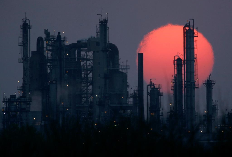 oil refinery, silhouetted, sun,