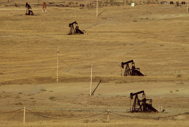 Four pump jacks dot the landscape at Naval Petroleum Reserve No.3 near Casper, Wyoming.