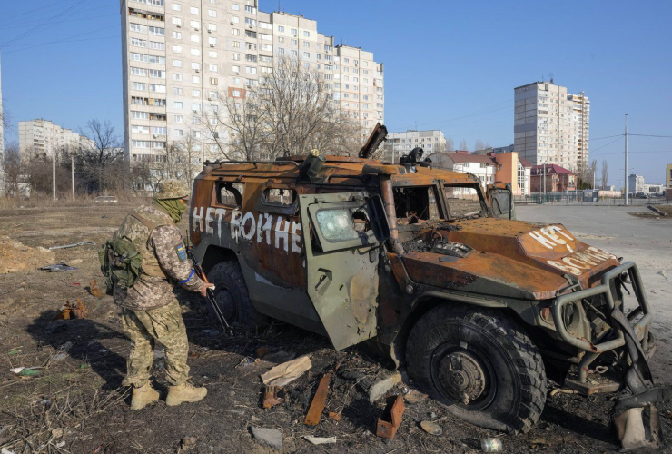 Ukrainian soldier, Russian APC, Kharkiv, Ukraine, 