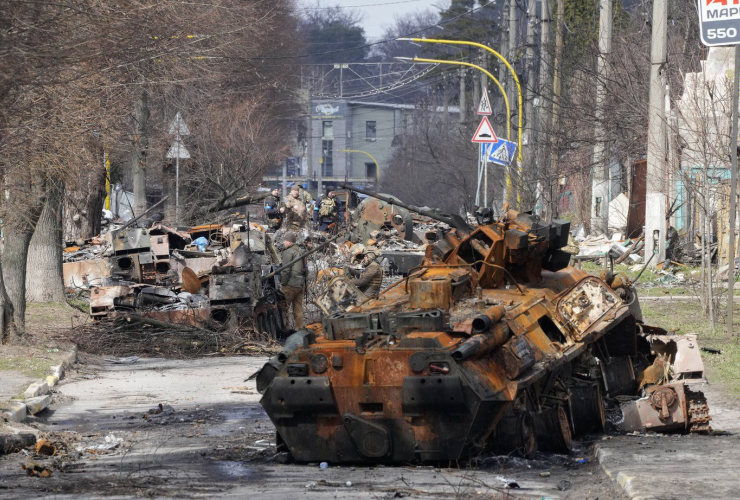 Ukrainian soldiers, Russian military vehicles, Bucha, Kyiv, Ukraine, 