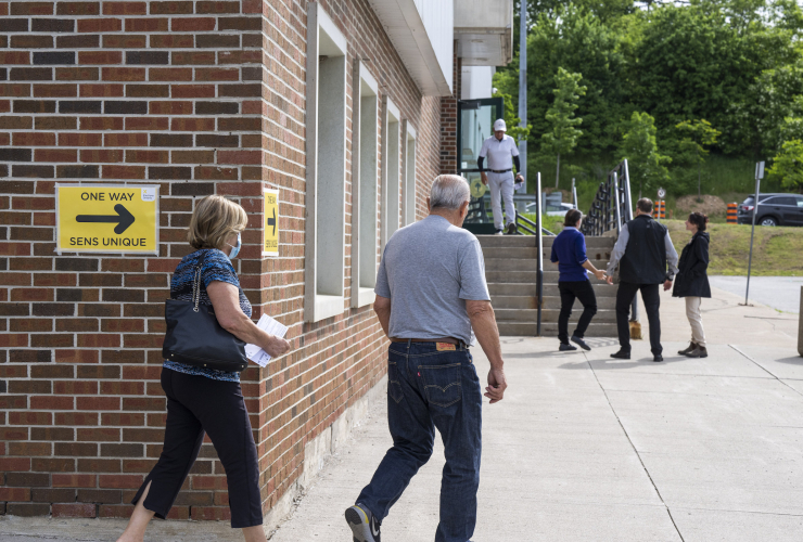 People leaving a polling station in Ontario