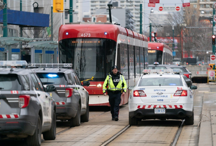 Police cars, TTC streetcar, Spadina Ave., Toronto